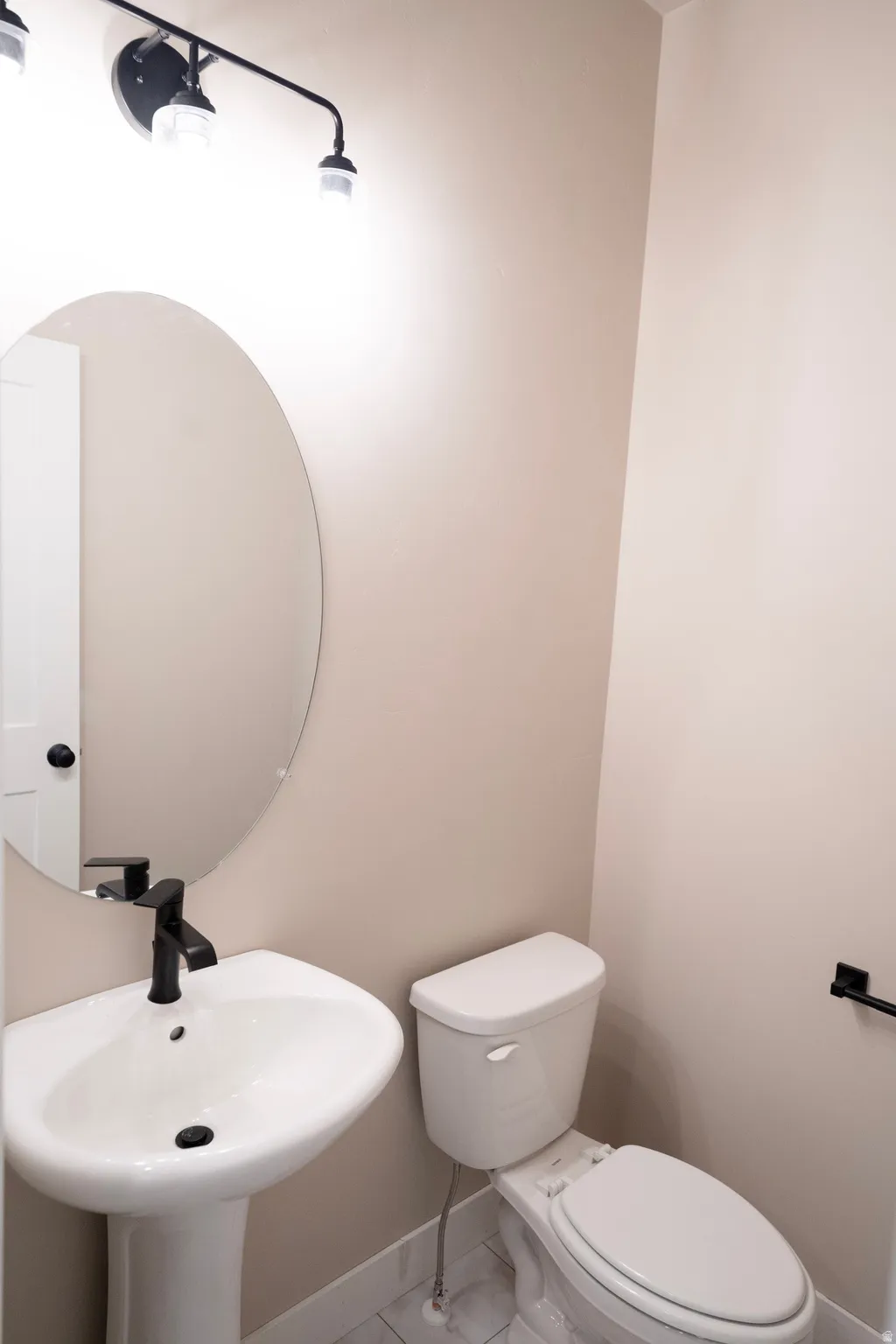 Bathroom featuring toilet and tile patterned floors