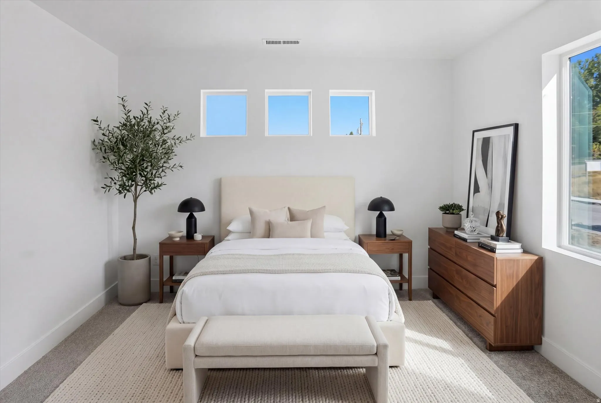Carpeted bedroom featuring baseboards