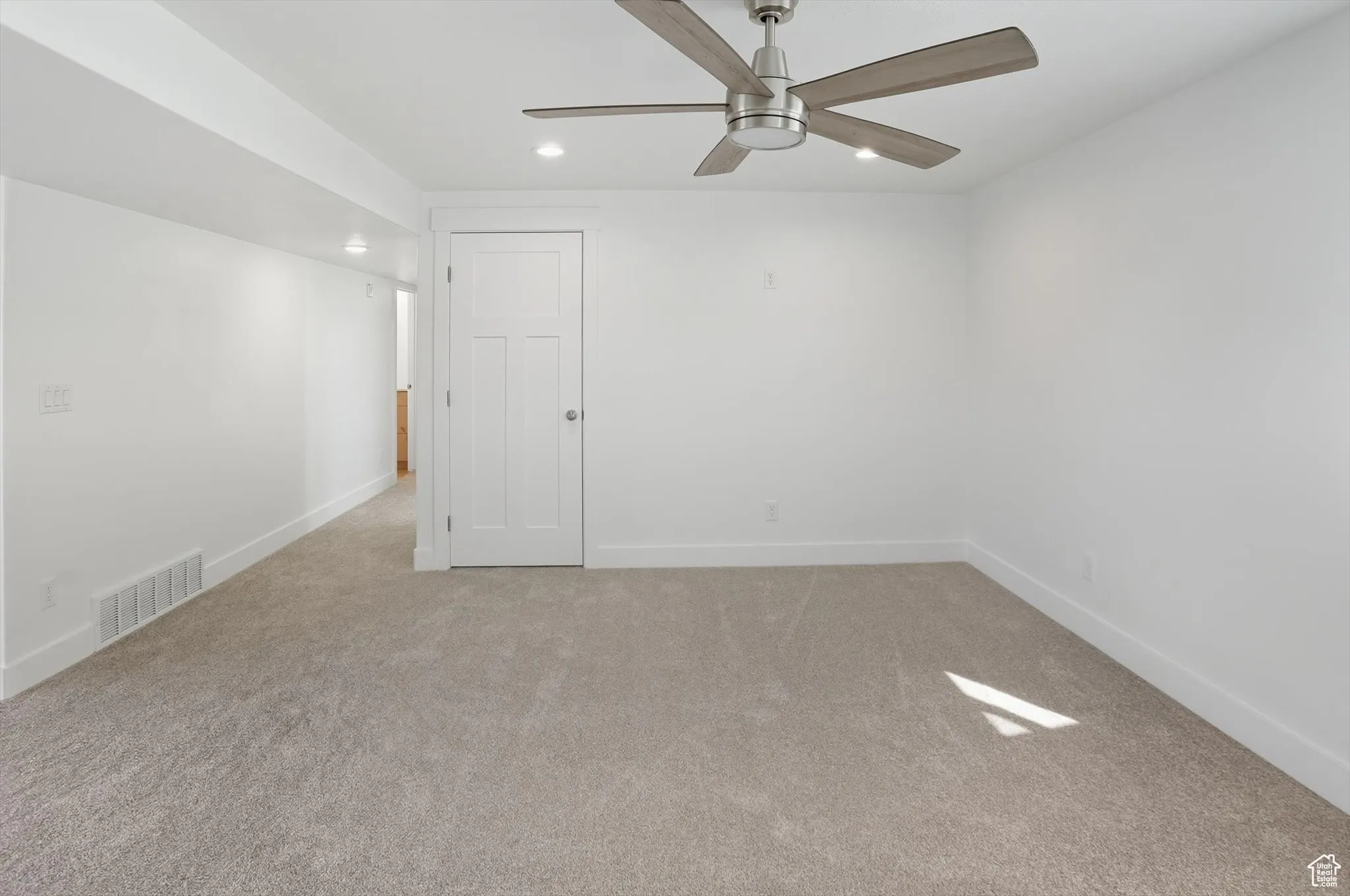 Spare room with light colored carpet, recessed lighting, and ceiling fan