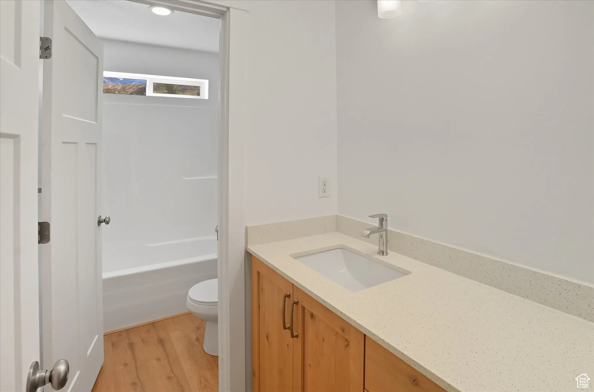 Bathroom featuring vanity and light wood-style floors