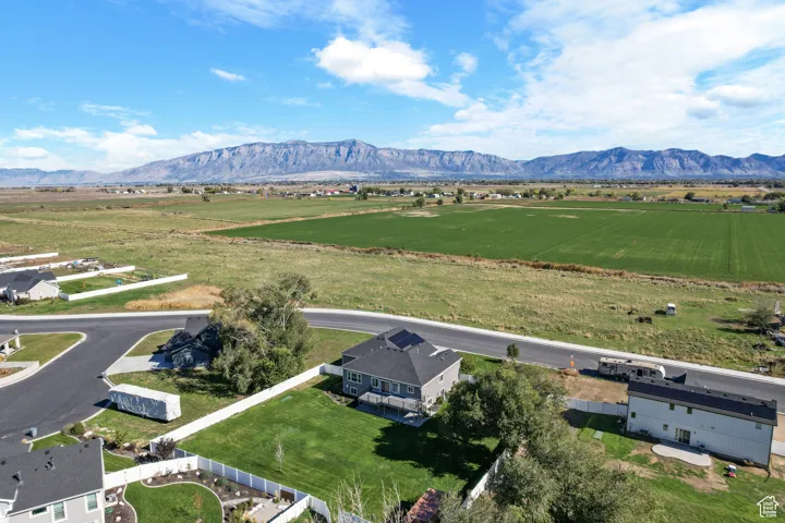 Aerial view of sparsely populated area featuring a mountain backdrop