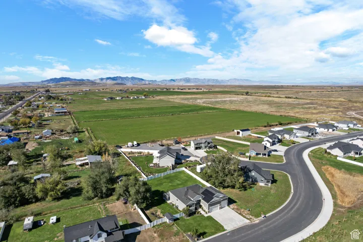 View of property location featuring rural landscape and nearby suburban area