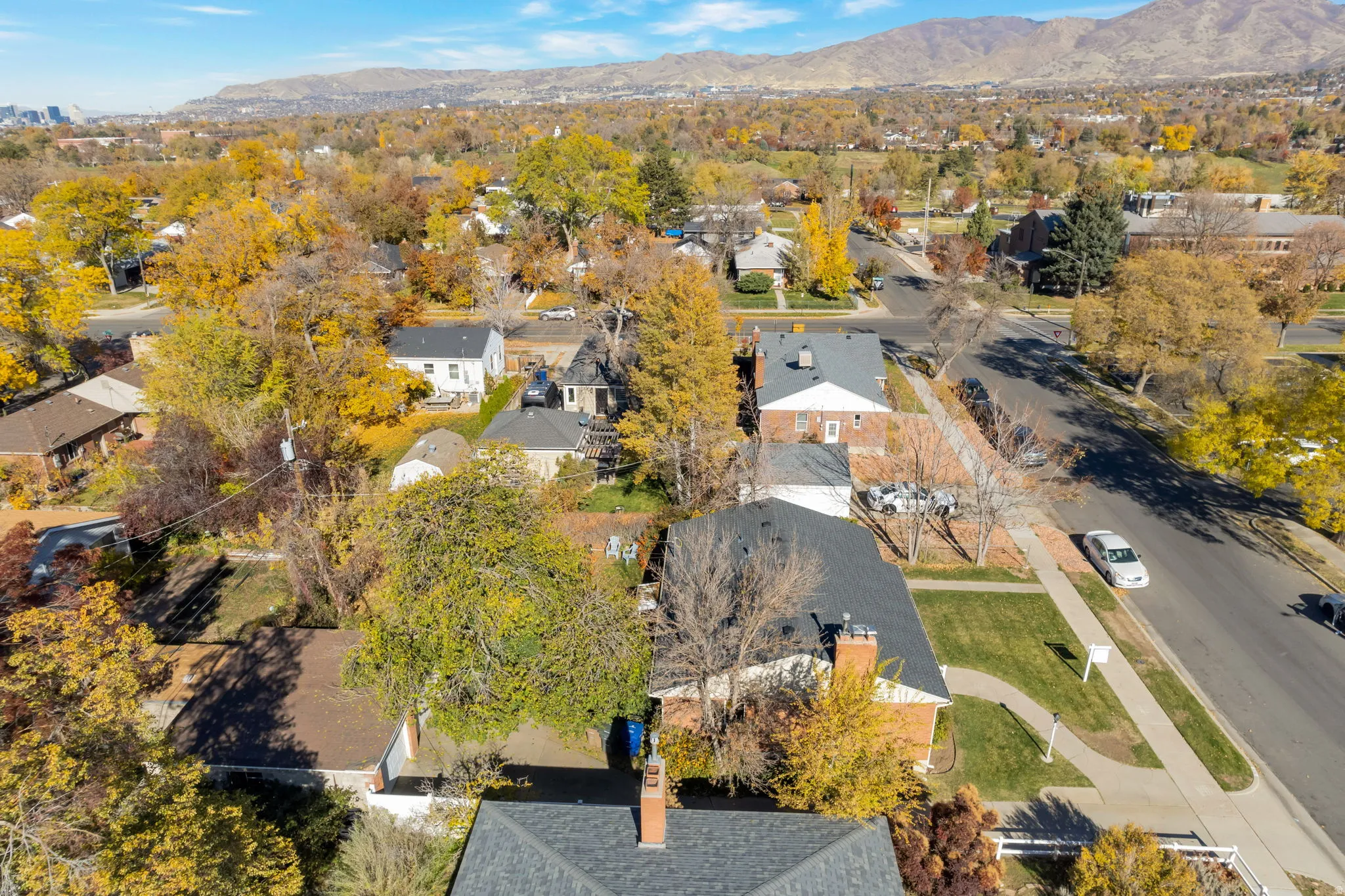 Aerial perspective of suburban area with a mountainous background