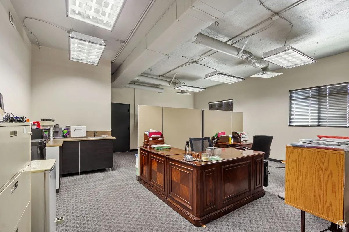 Home office with light colored carpet