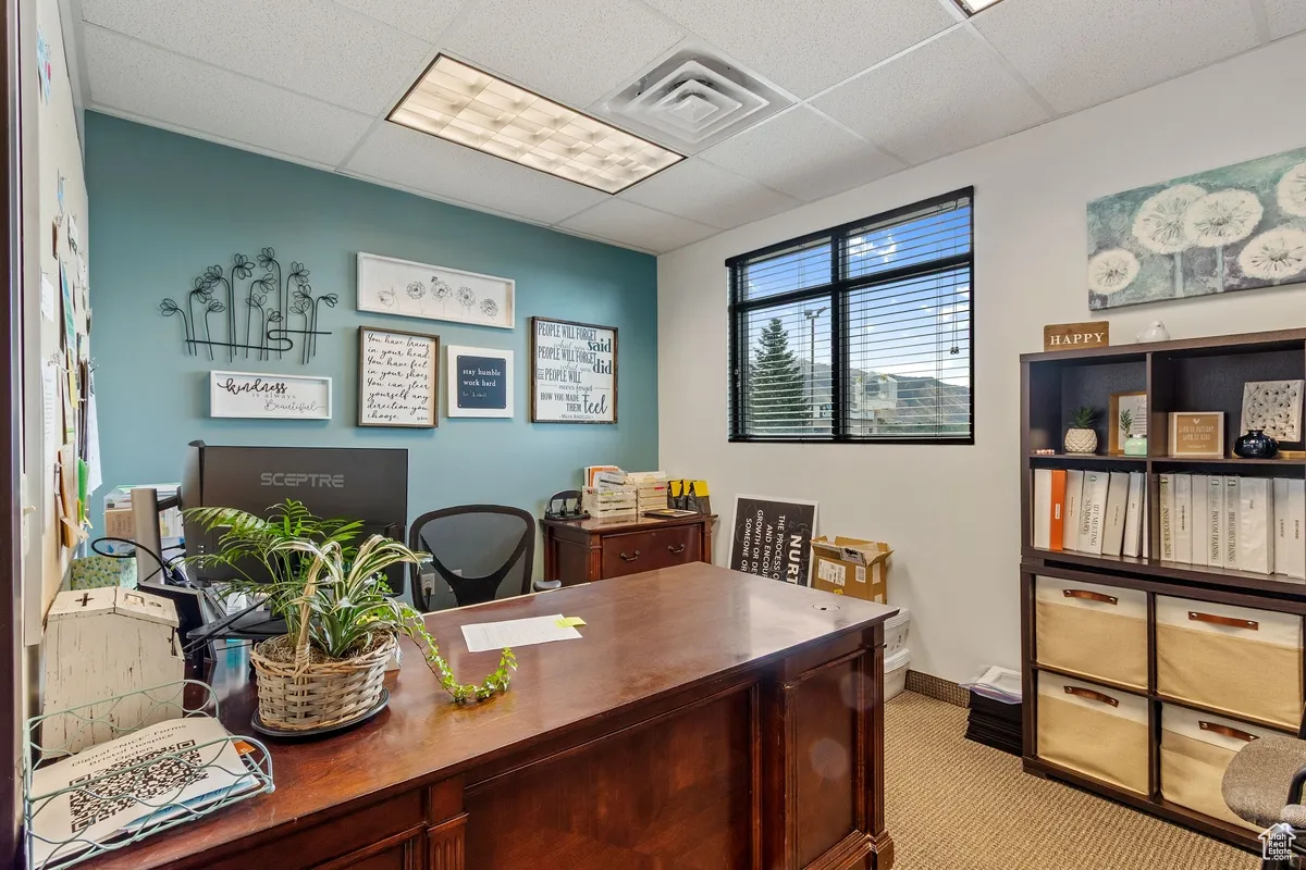 Office featuring a drop ceiling