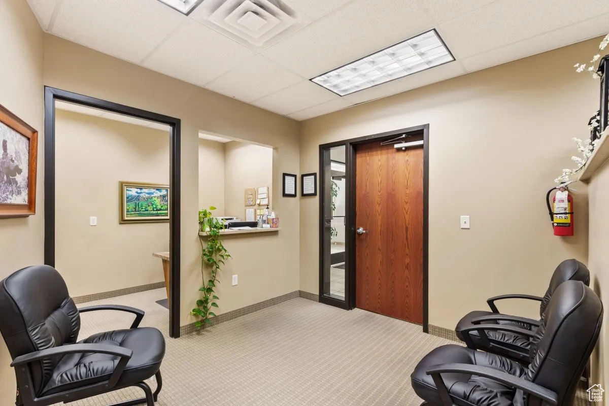 Office space with a paneled ceiling
