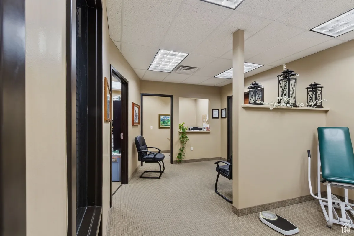 Office area with a paneled ceiling