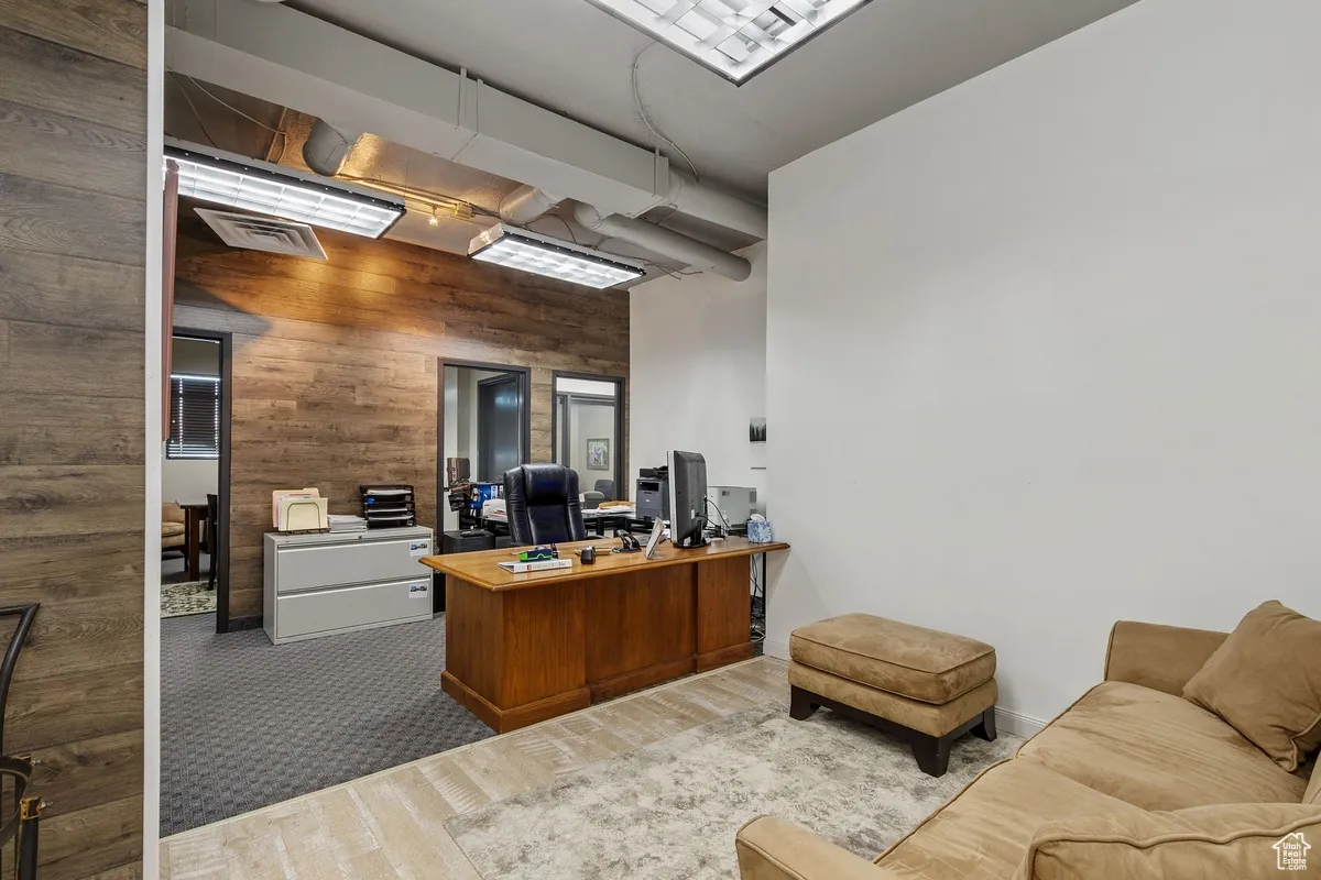 Home office with wooden walls