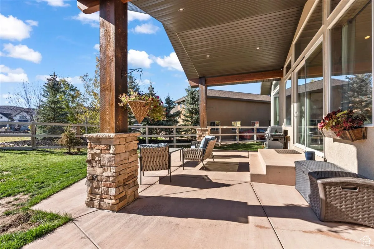 View of  back covered patio- accessible from Primary bedroom and Great room.