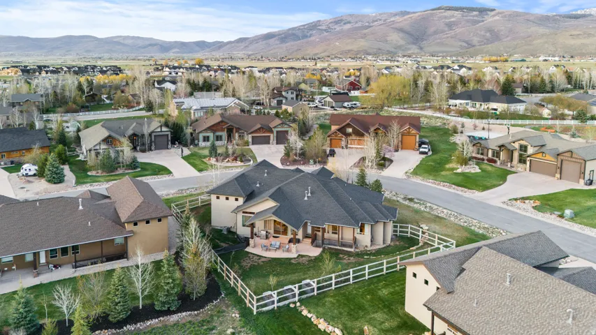 Aerial perspective of suburban area with a mountainous background
