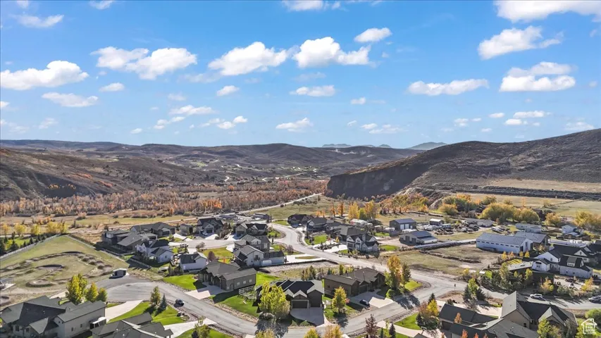 Aerial perspective of suburban area with a mountainous background