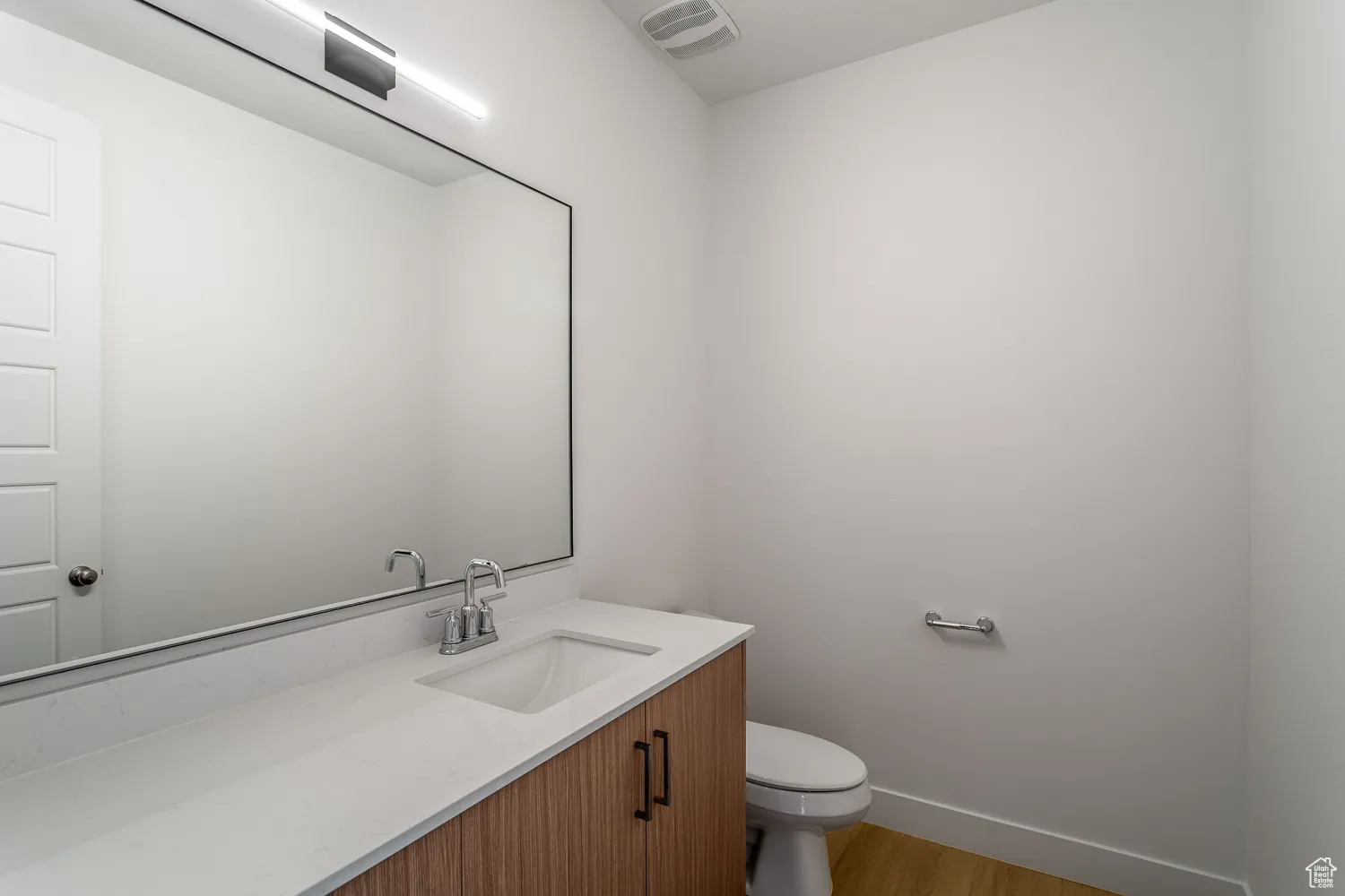 Bathroom with vanity and light wood-type flooring