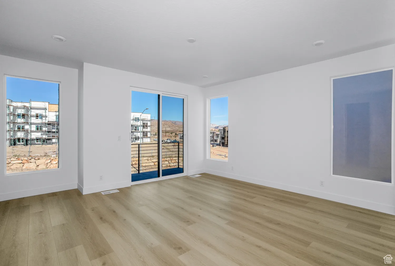 Empty room featuring light wood-style flooring and baseboards