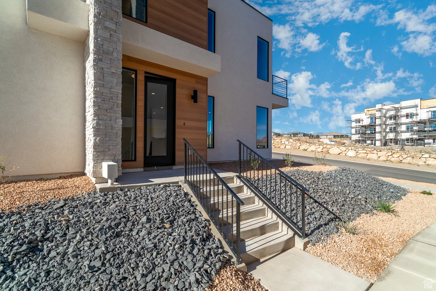 Entrance to property featuring stucco siding