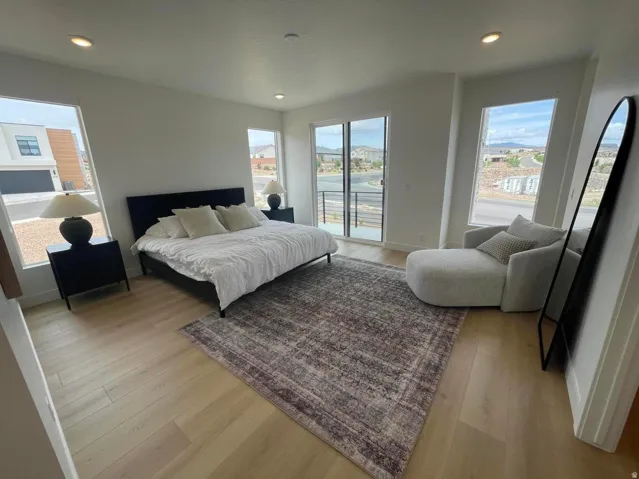 Recessed lighting, wood-finish flooring, and multiple windows