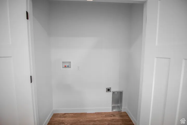 2nd floor Laundry room with LVT flooring, washer hookup, and electric dryer hookup