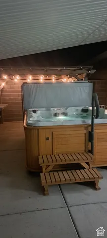 View of patio featuring a hot tub