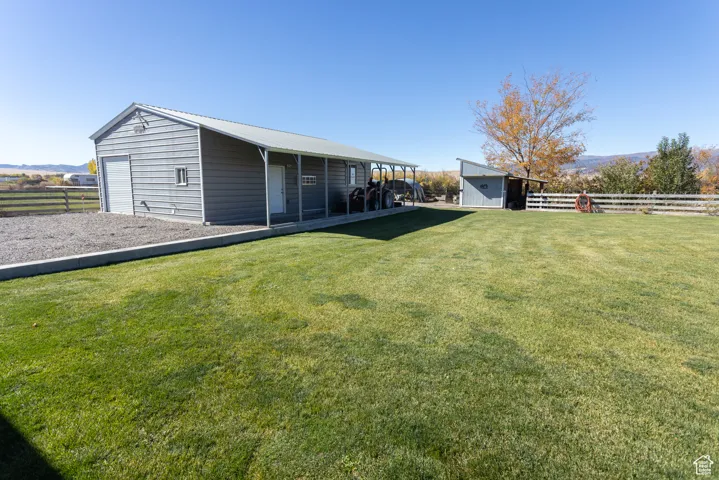 View of yard featuring a storage shed and a mountain view
