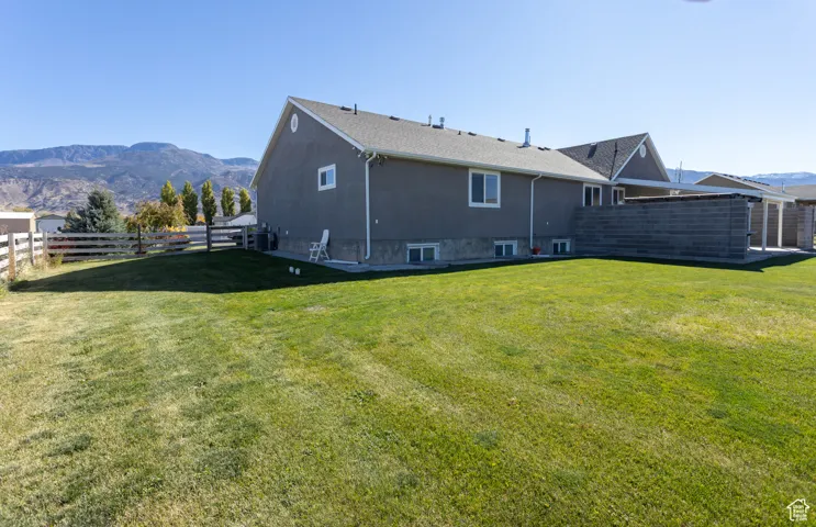 Back of house with a mountain view