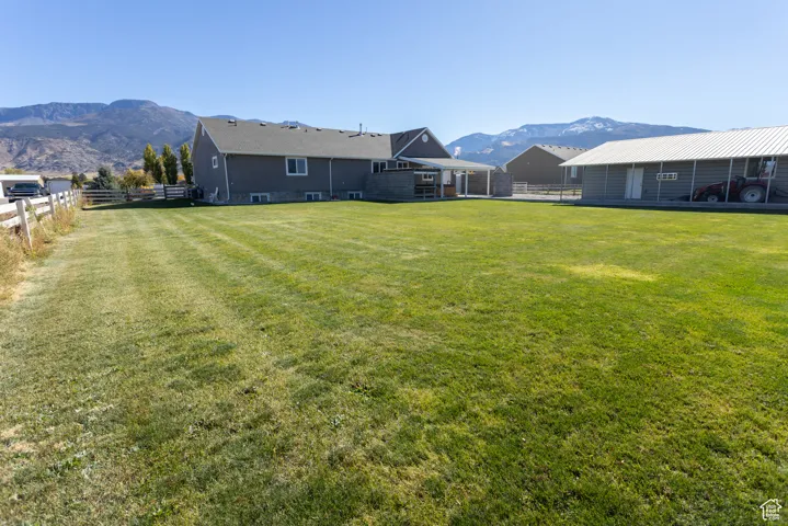 Fenced backyard with a mountain view