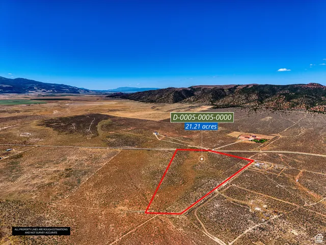 View of rural area with a mountain backdrop and property parcel outlined