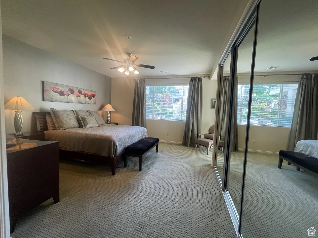 Master  bedroom Carpeted bedroom with a closet and a ceiling fan