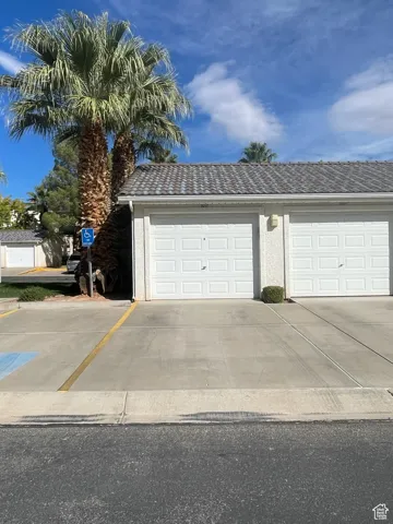 Garage featuring driveway