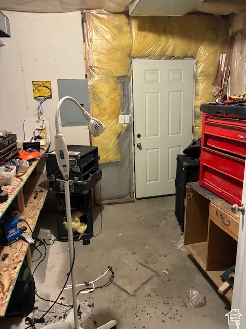 Unfinished below grade area with electric panel