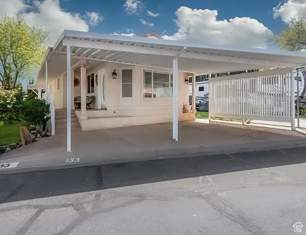 View of patio with an attached carport