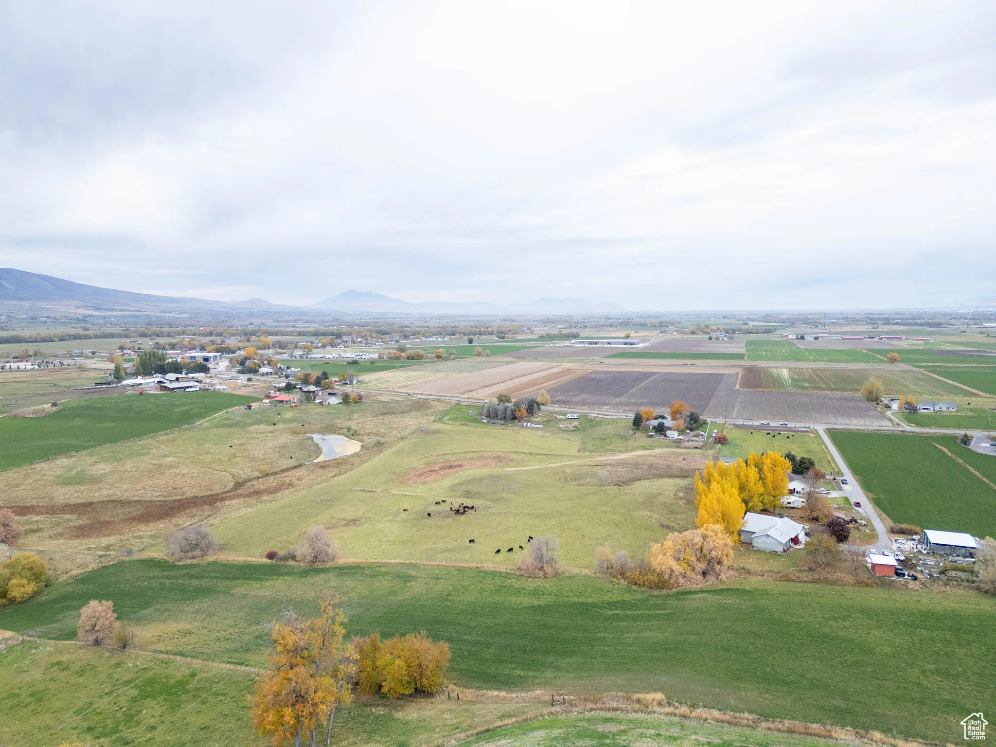Aerial view of property's location featuring rural landscape and a mountain backdrop