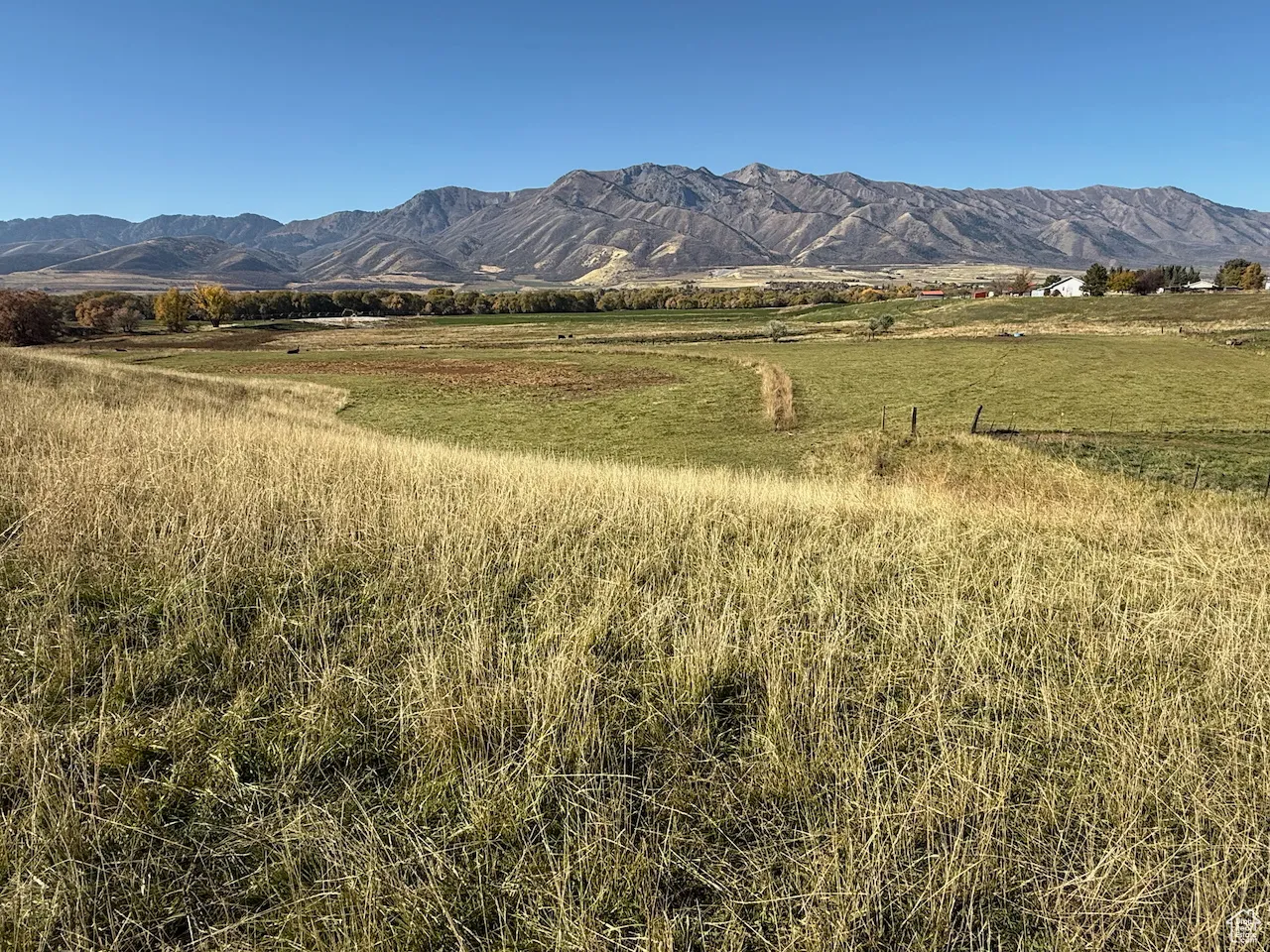 View of mountain backdrop featuring rural landscape