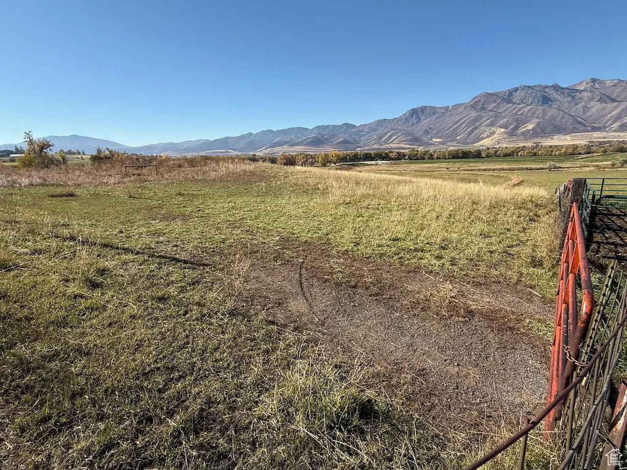 View of mountain backdrop featuring rural landscape