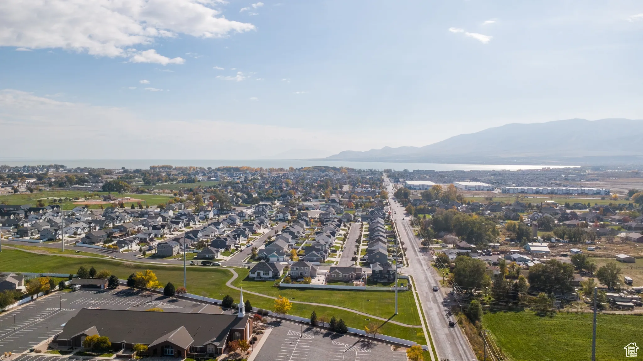 Aerial view of residential area featuring a water and mountain view