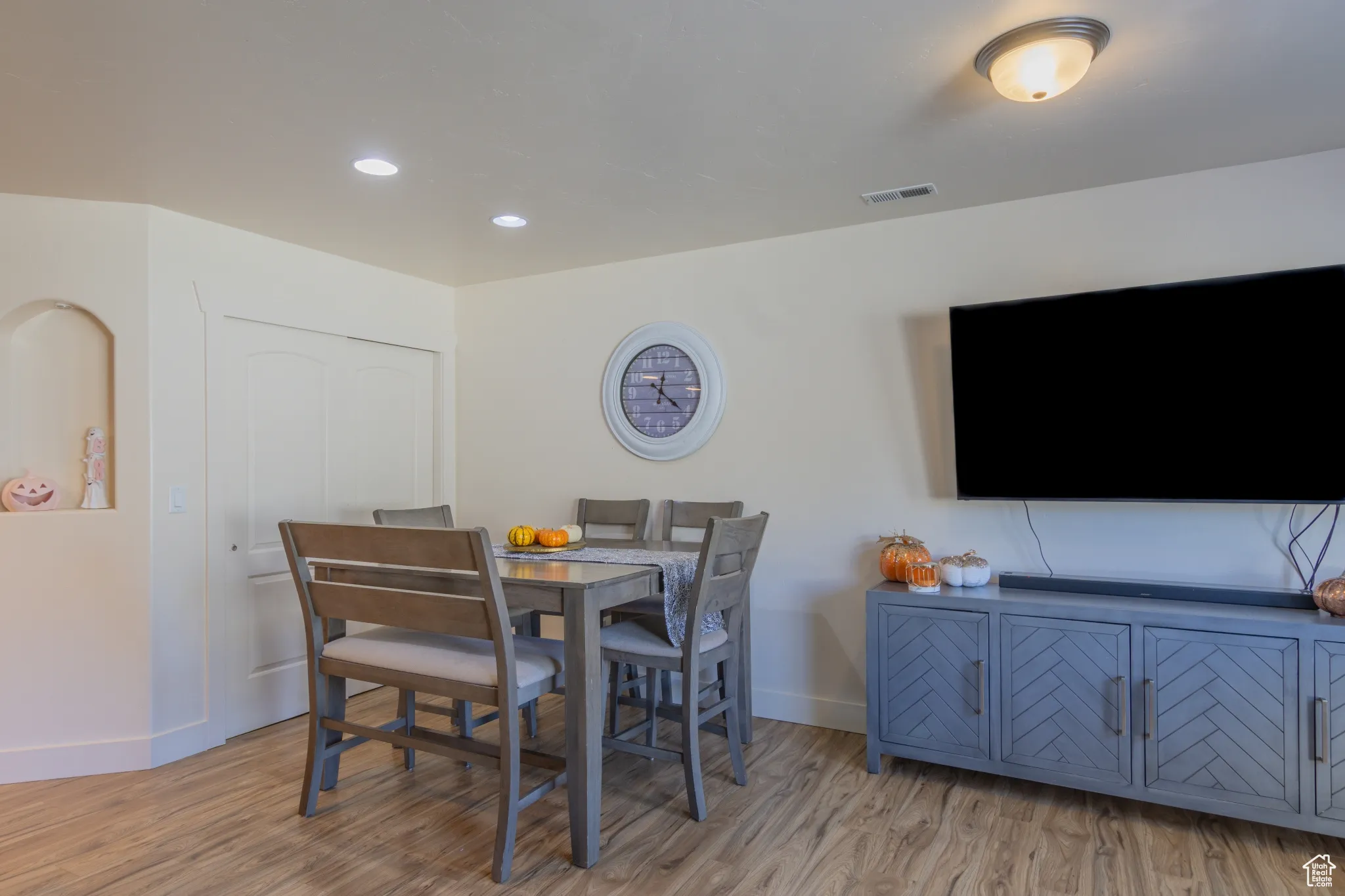 Dining room featuring light wood-style flooring and recessed lighting