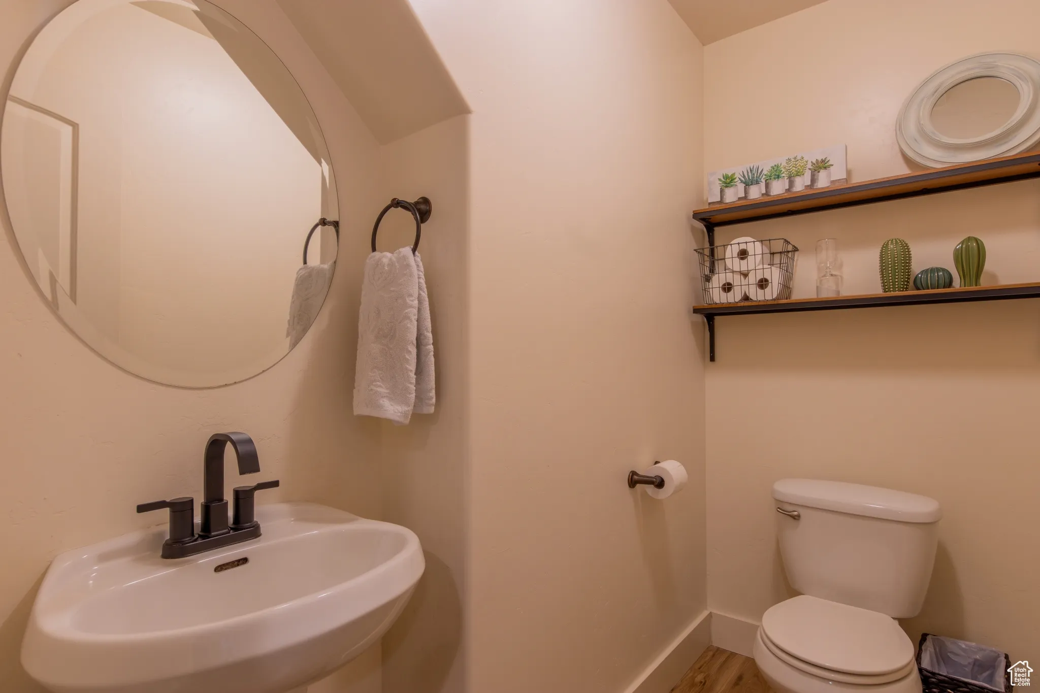 Half bath featuring a sink and toilet