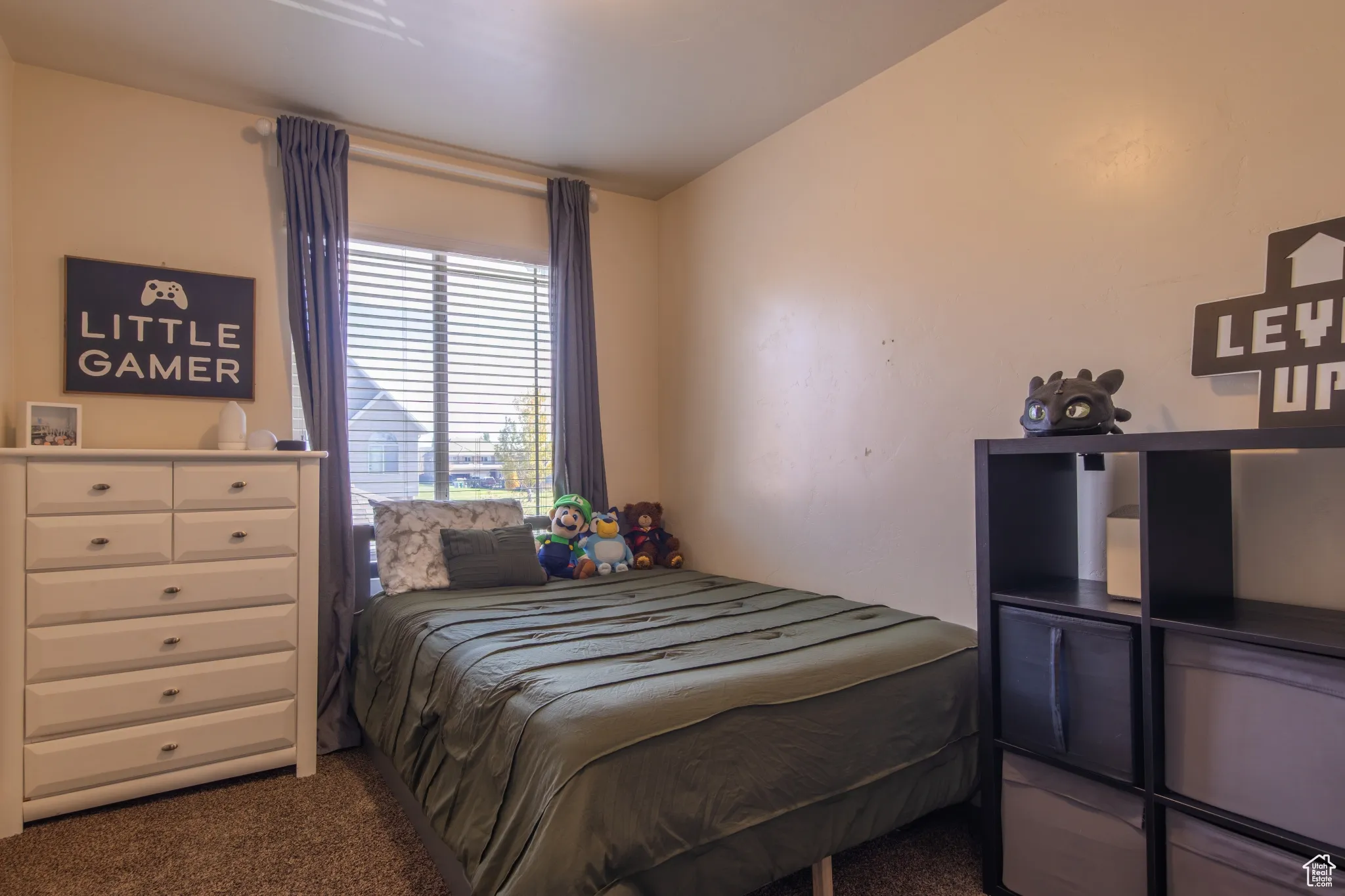 Bedroom with dark colored carpet