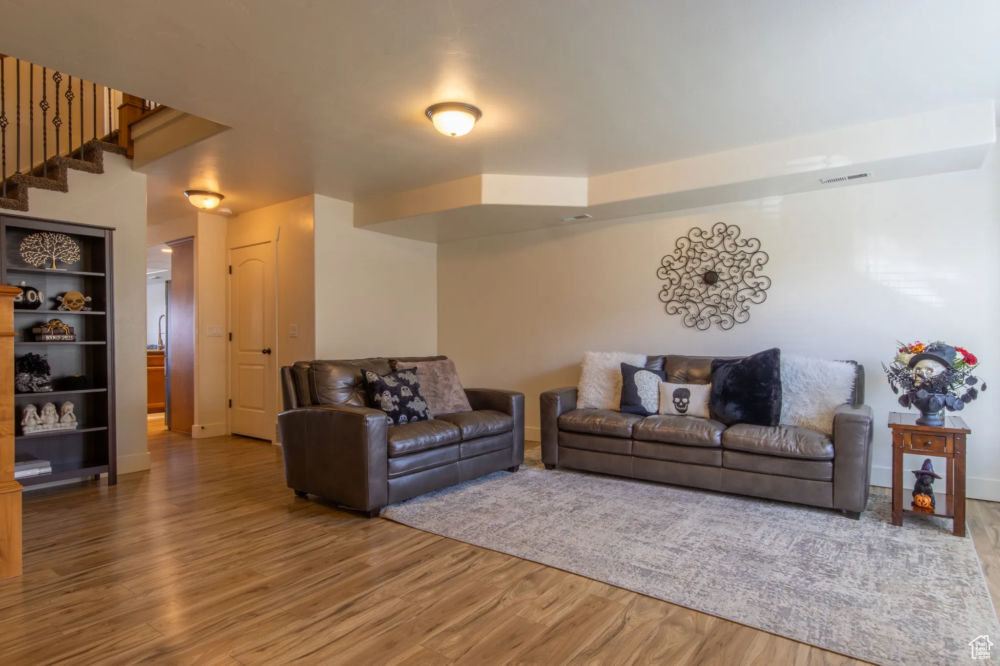 Living room with wood finished floors and baseboards