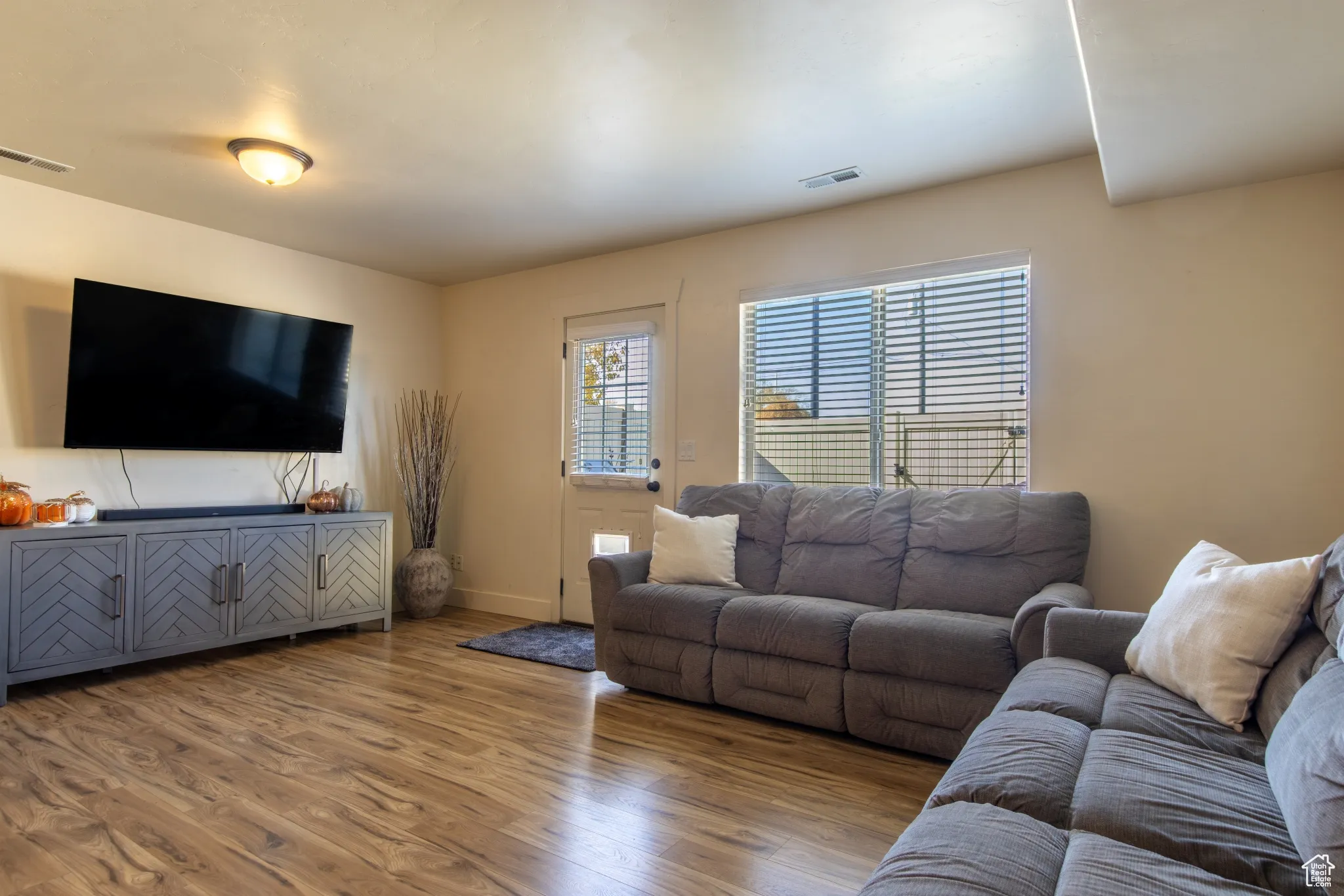 Living room with wood finished floors and baseboards