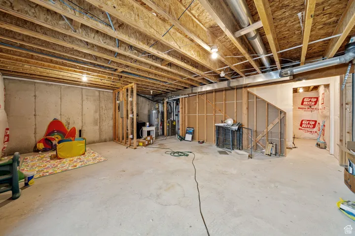 Unfinished basement with electric water heater