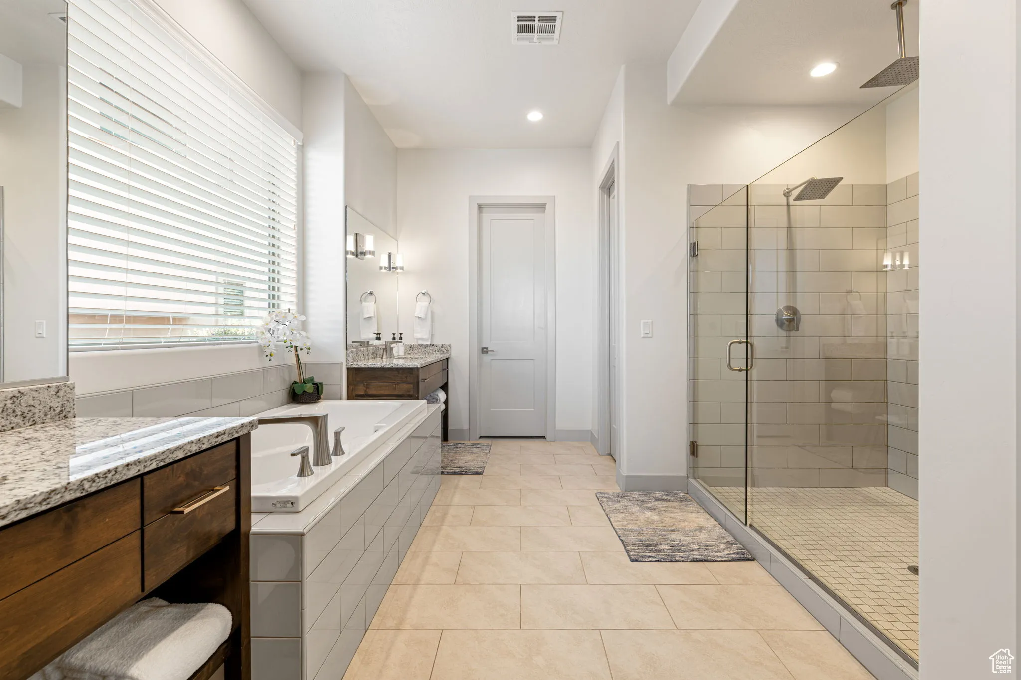 Full bathroom featuring a garden tub, a shower stall, vanity, light tile patterned floors, and recessed lighting