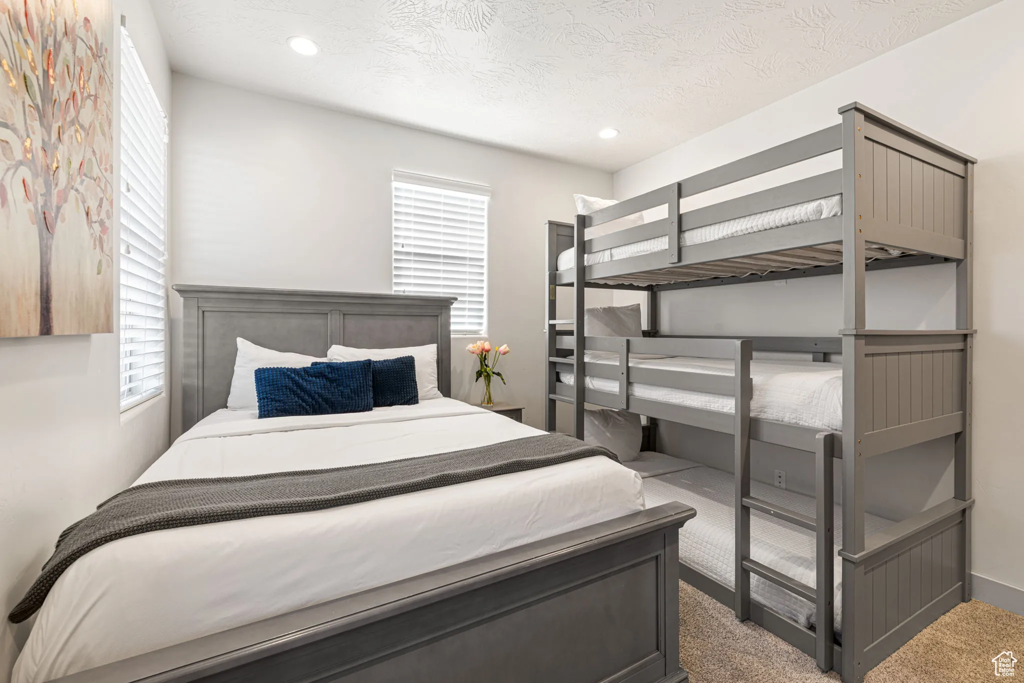 Bedroom featuring carpet, a textured ceiling, and recessed lighting