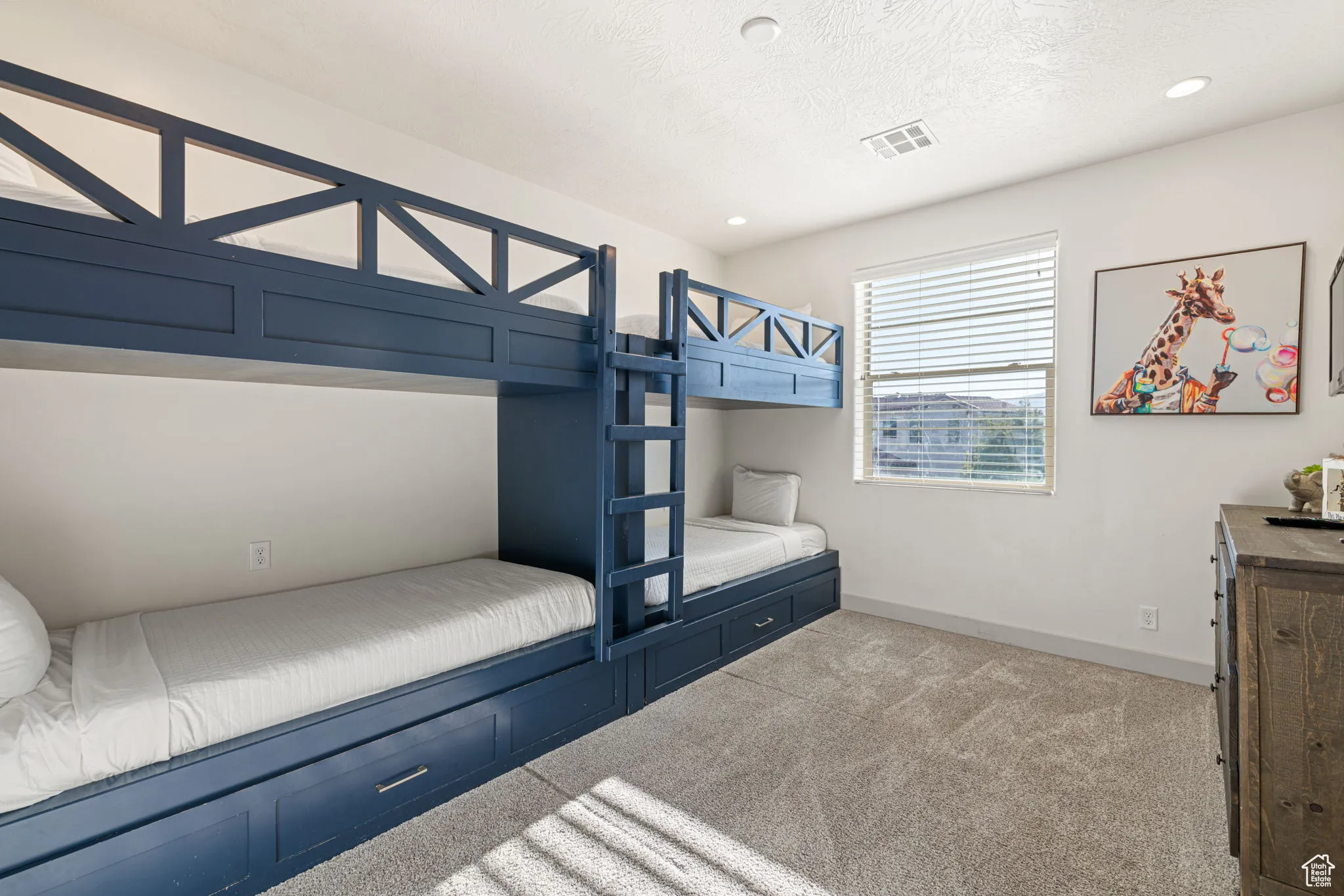 Unfurnished bedroom with light colored carpet, recessed lighting, and a textured ceiling