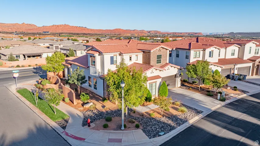Aerial view of residential area featuring a mountain backdrop