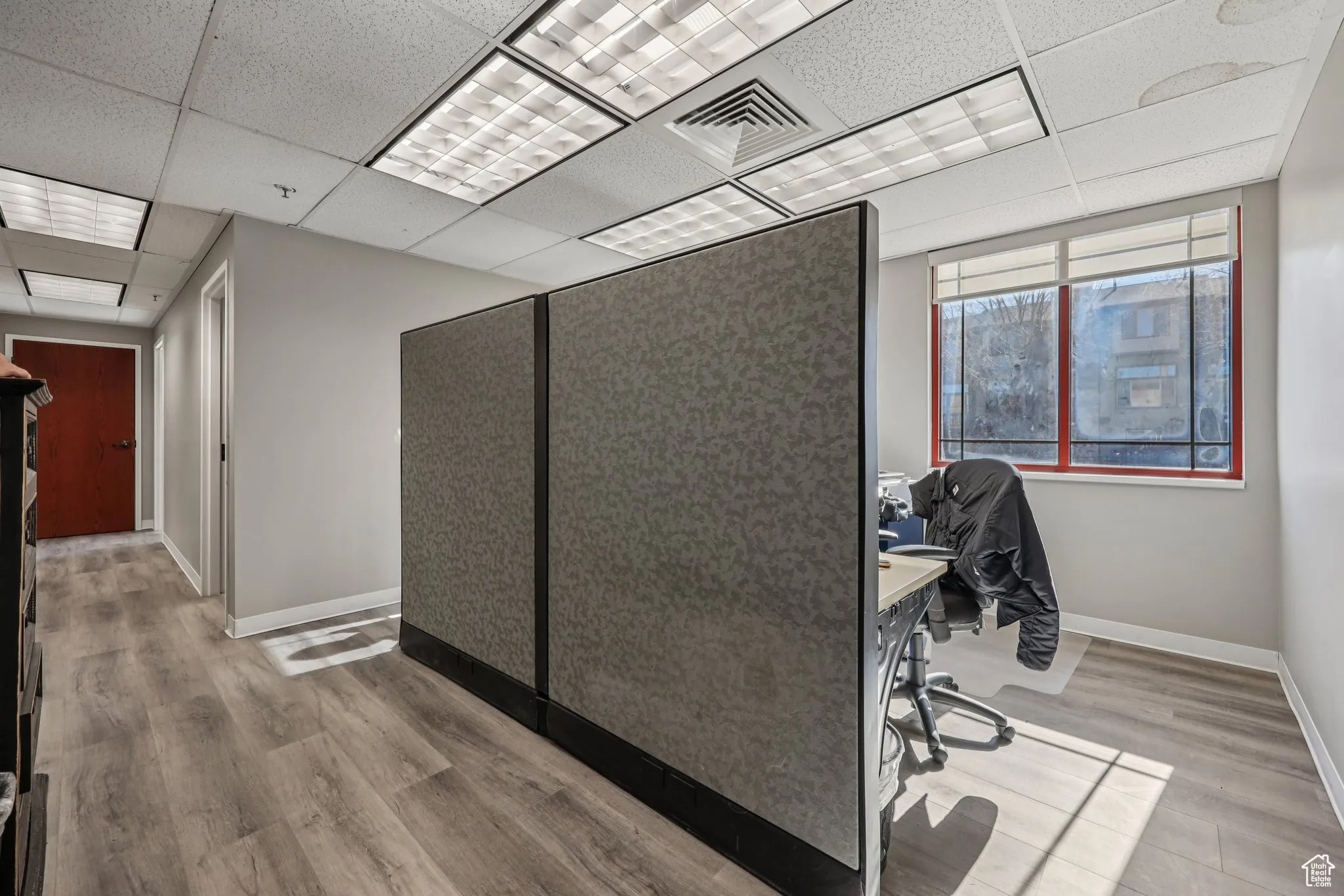 Home office featuring a drop ceiling