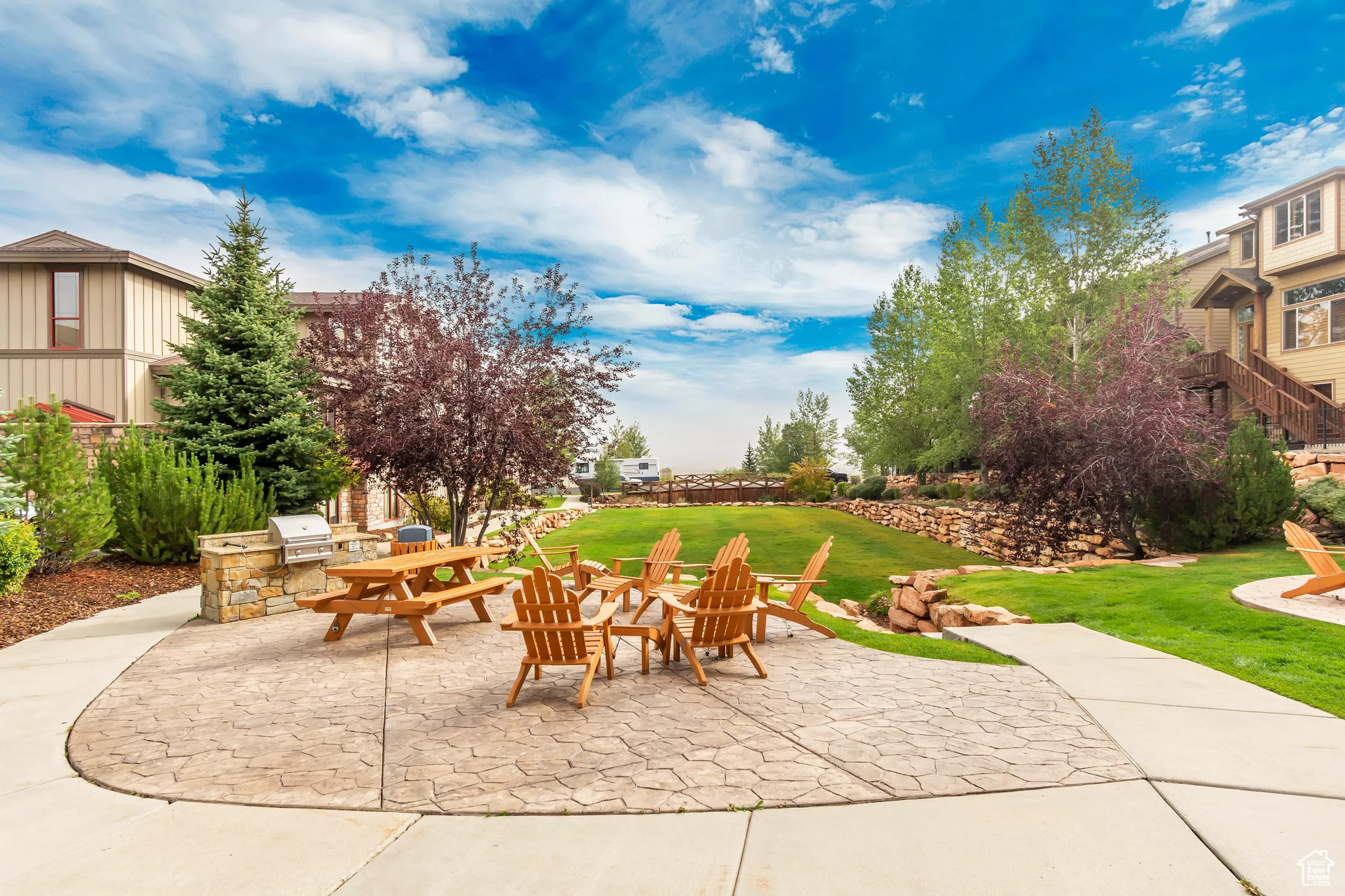View of patio / terrace featuring an outdoor fire pit and exterior kitchen