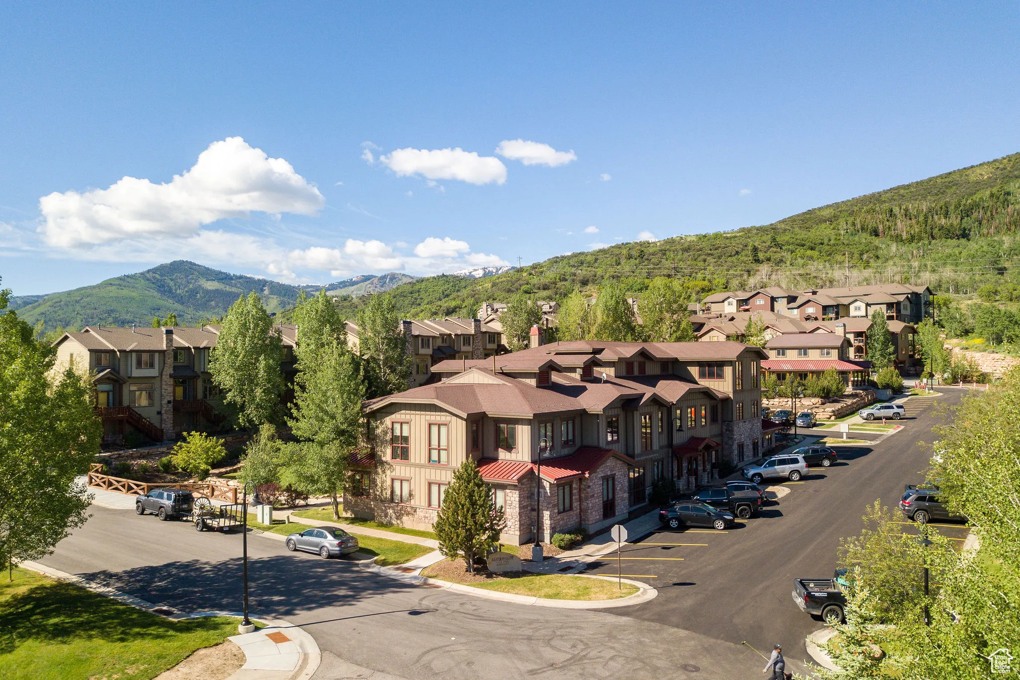 Aerial perspective of suburban area featuring a mountainous background