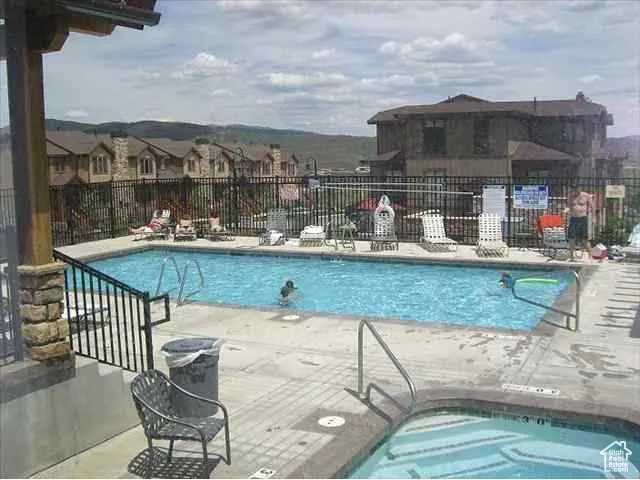 Community pool with a patio area