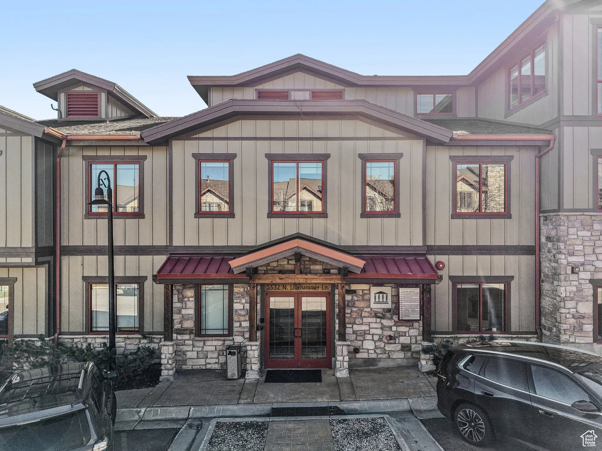 View of front of home with french doors, a standing seam roof, and a metal roof