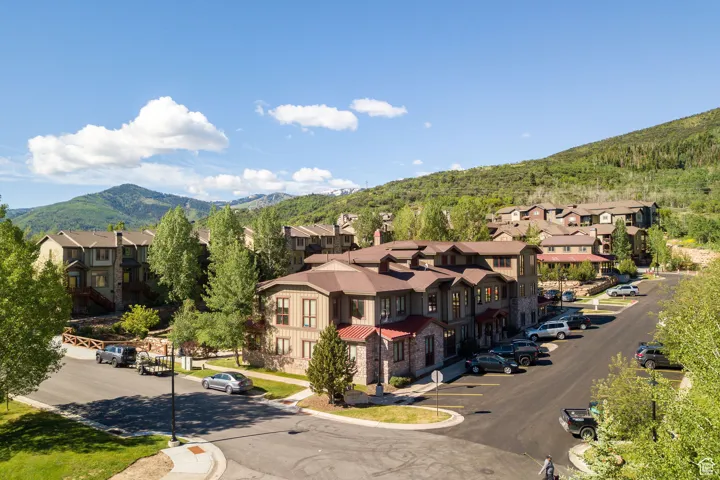 Aerial perspective of suburban area featuring a mountainous background