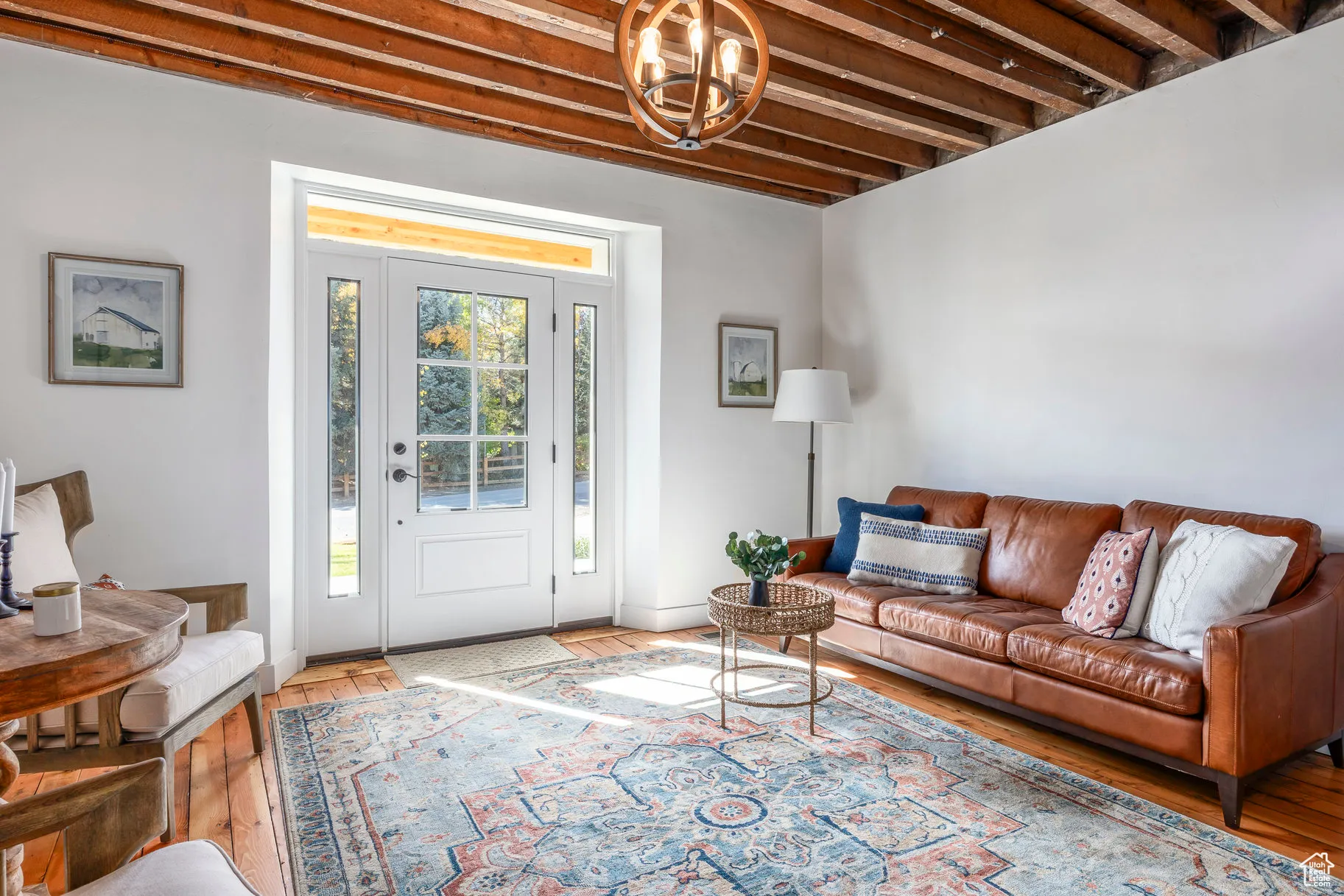 Living area with wood finished floors and baseboards